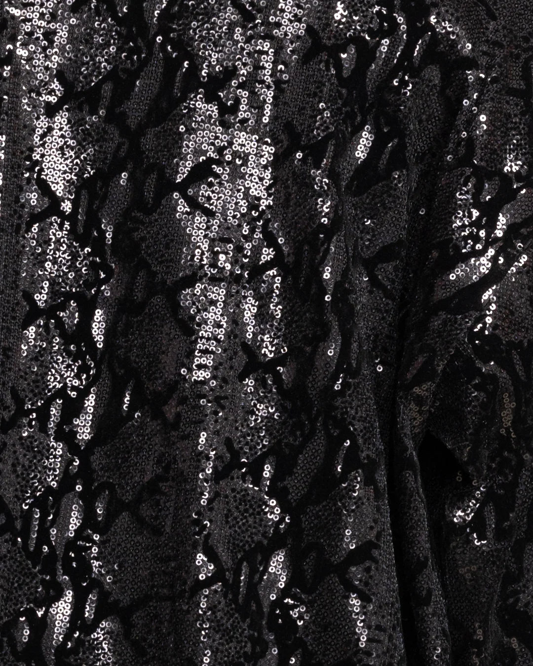 Close-up of shiny black sequin kimono fabric with a small reflective sequins.