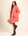 Vibrant pink fake fur jacket from a top-rated vegan fashion brand, featuring cruelty-free style and custom buttons.