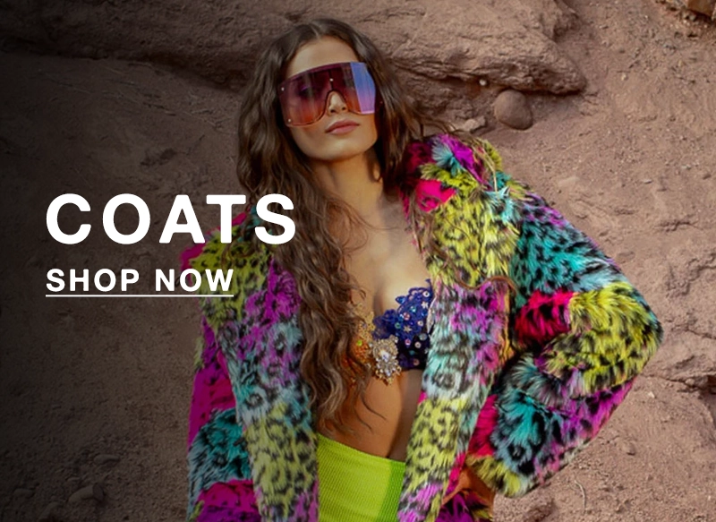 Woman wearing a colorful coat and sunglasses against a rocky background with 'COATS SHOP NOW' text.