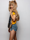 Woman wearing faux fur Collector Edition Coyote SpiritHood, side view 1