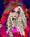 Woman with vibrant pop-art style crosses over her eyes with neon pink makeup and colorful SpiritHoods Collector Edition Calico Cat Fake Fur coat against a dark background. Easy Halloween Costume Ideas for Women, Halloween Outfits