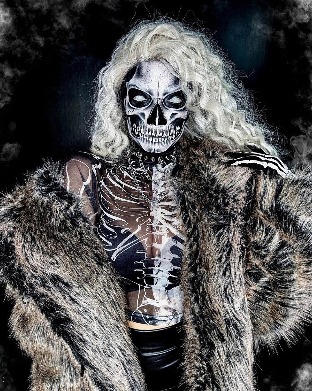 Woman wearing SpiritHoods Grey Wolf Classic Fake Fur Jacket with the hood off, showing painted skull make up - halloween costume ideas featuring SpiritHoods  women's fake fur coats