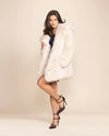 100% Fake Fur Ivory Wolf Jacket from a vegan fashion brand, featuring cruelty-free white plush fur and 4 pockets.