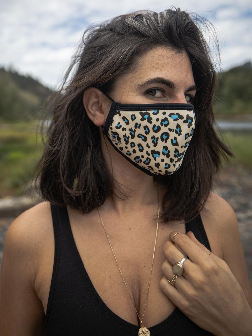 Woman wearing Blue Spotted Leopard Copper-Threaded Face Mask, side view