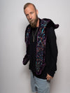 Man wearing faux fur Collector Edition Midnight Wolf SpiritHood, side view 1