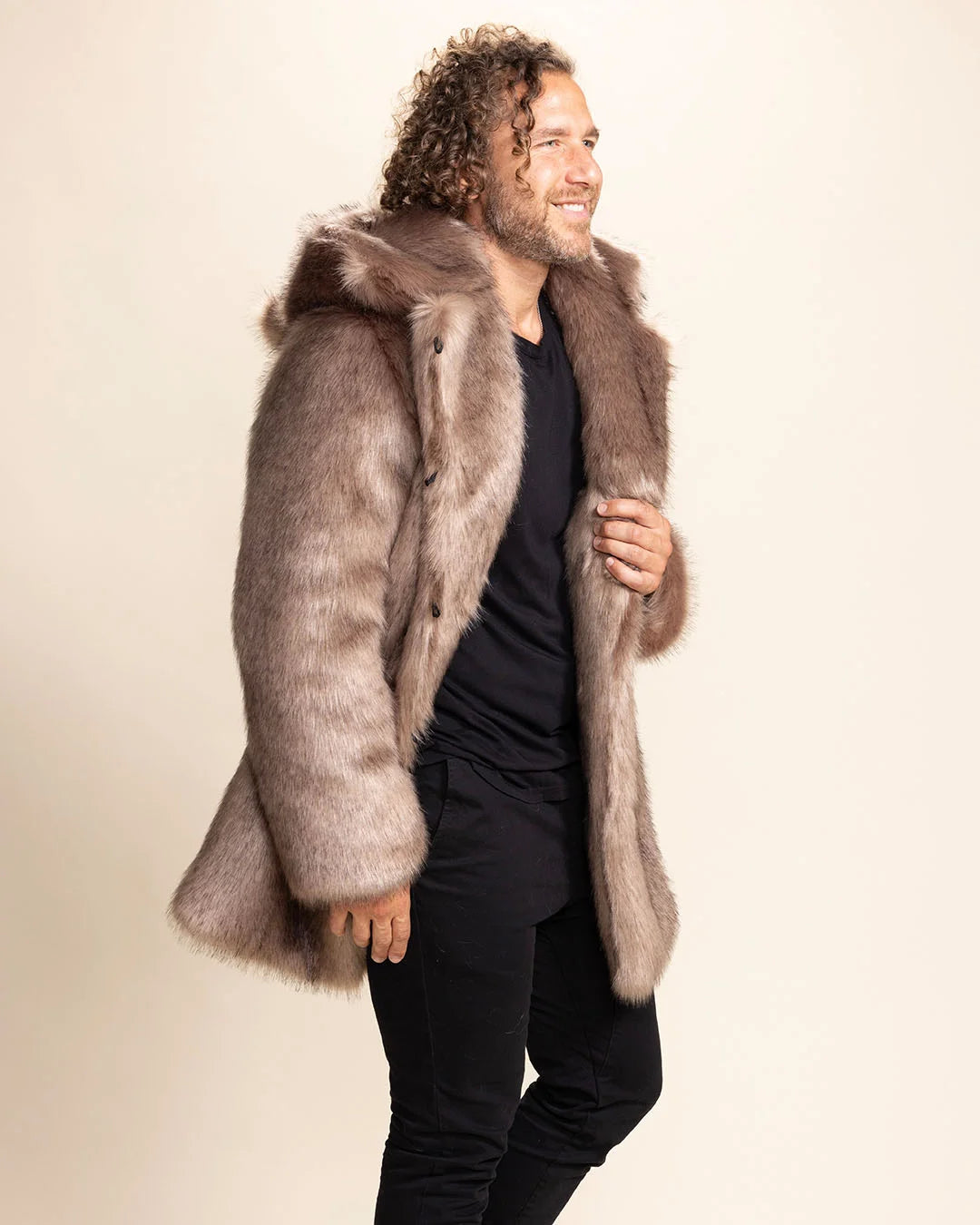 A Man wearing a brown faux fur coat with a hood and wolf ears, on a plain background. SpiritHoods Fall Winter Collection of 100% Fake Fur Coats and Faux Fur Jackets