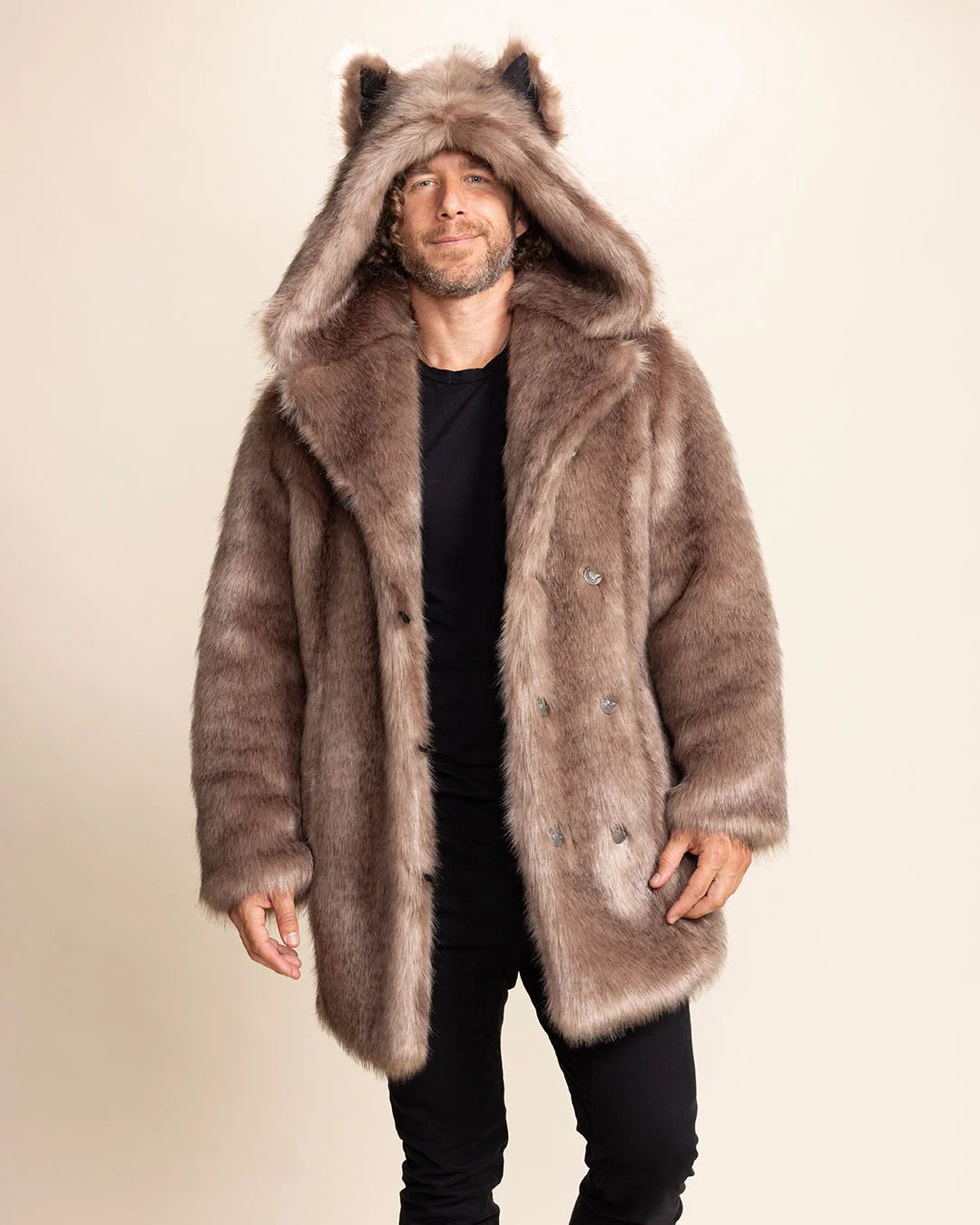 A Man smiling at the camera, wearing a brown faux fur coat as he walks forward. SpiritHoods relaxed fit men's fall/winter faux fur coats and jackets.