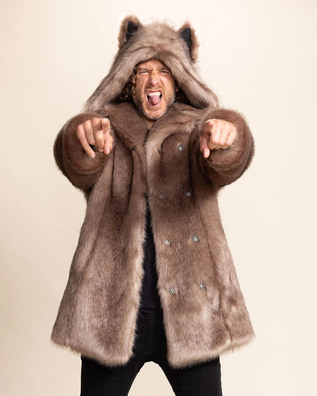 A Man pointing at  the camera doing RAWR face, wearing SpiritHoods Italian Wolf Classic Brown Faux Fur Coat, with his hands up you can see the beautiful wolf face buttons down the wearer's left side. PETA approved vegan fashion brand.