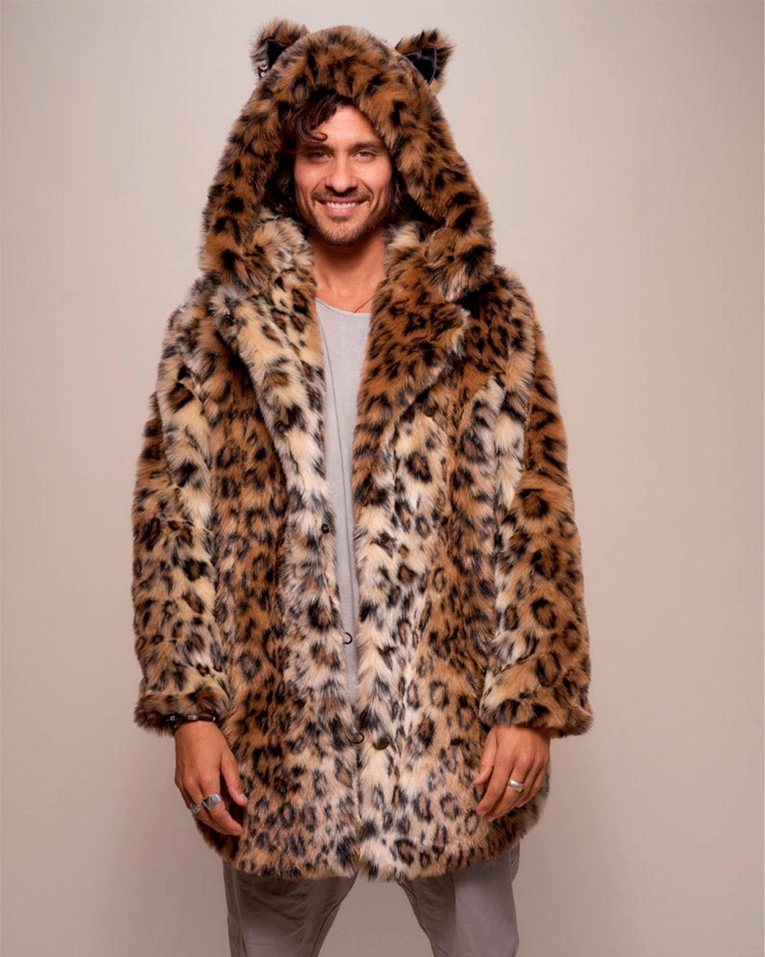 A Man wearing SpiritHoods Best Selling Classic leopard print fake fur coat with hood and feline ears on a plain background.