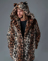A Man wearing a leopard print fake fur coat with leopard ears and leopard spots,  on a grey background. SpiritHoods Best Selling Classic Leopard Faux Fur Coat now available for custom orders, limited waste eco-friendly production.