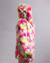 A person wearing a bright neon multicolor faux fur hooded jacket, shown from the side against a plain light gray studio background.