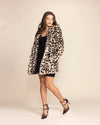 Luxury Burning Man outerwear for women featuring the Oncilla leopard faux fur coat with a plush, soft texture.