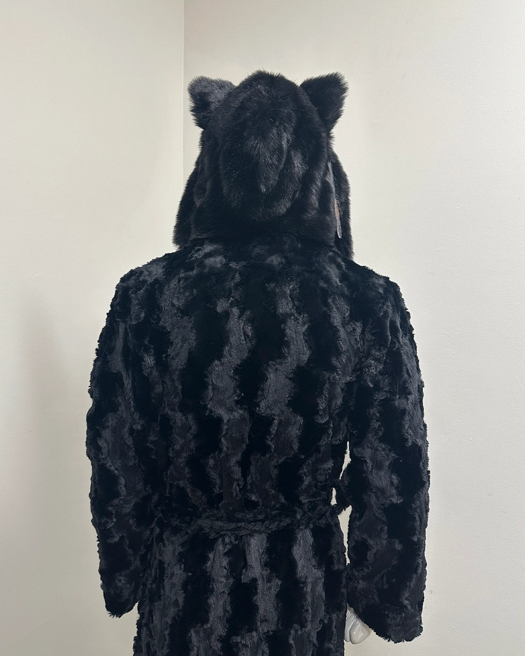 Black textured robe with cat ears on a white background