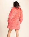Bold date night look featuring an oversized pink collared faux fur coat and four deep functional pockets.