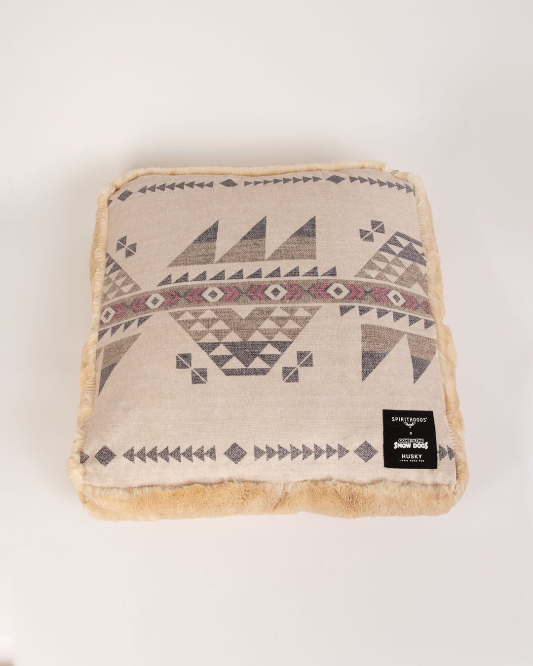 small pet bed with geometric pattern on a white background