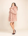 Feline inspired vegan fashion: a plush shaggy pink alpaca fake fur parka with feline ears and 4 functional pockets.