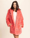 Animal inspired faux fur coat in bright coral pink for women, offering endless styling options for bold streetwear.