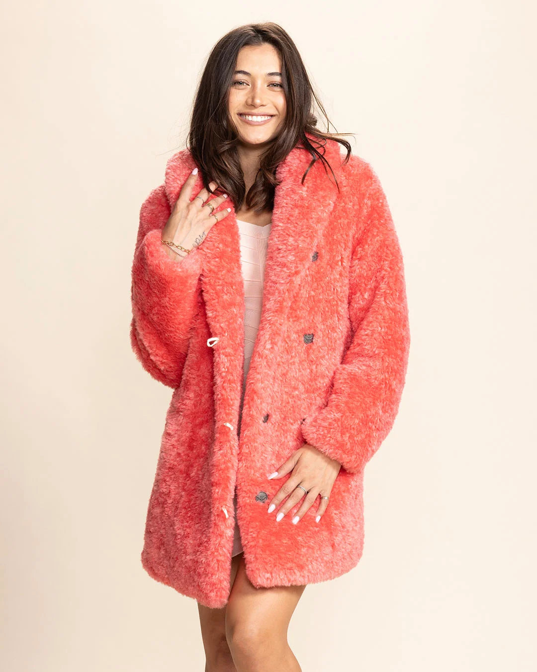 Woman wearing a Pink Panther faux fur coat featuring a plush 100% vegan fake fur and an oversized collar.
