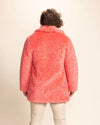 High-end men's streetwear: a bright pink panther faux fur coat with a relaxed fit and custom buttons