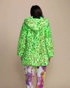 Rave aesthetic style: a woman in a neon green leopard faux fur jacket, ideal for night-time festival visibility.