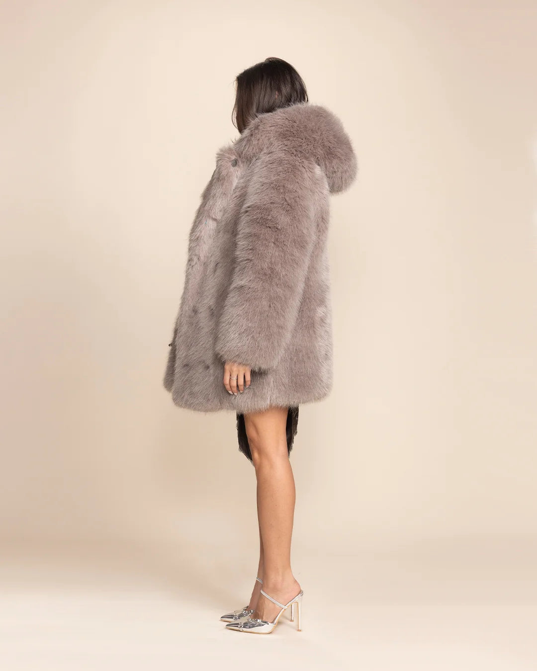 Side view of a woman in the Grey Fox hooded coat by SpiritHoods.