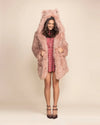 Woman wearing a shaggy pink LaPerm Cat classic faux fur coat featuring feline ears and an oversized hood.