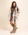 Woman wearing a SpiritHoods Made to Order Little Cheetah Fake Fur Coat and boots on a plain background. Fall Winter Collection of Animal Print Coats and Faux Fur Jackets 