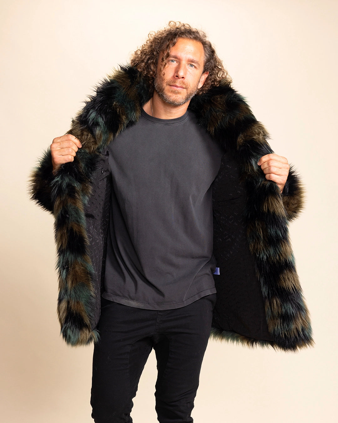 Man wearing a SpiritHoods Made To Order Camo Cat green and brown fake fur coat with a neutral background