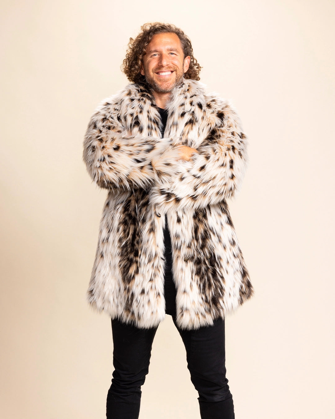 Man wearing a cheetah patterned fur free fur coat against a plain background. SpiritHoods Made to Order Animal Print Fake Fur Jackets for Men