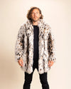 Man wearing a cheetah print fake fur jacket with the collar down, against a beige background. SpiritHoods Made To Order Fall Winter Faux Fur Coats and Animal Print Jackets.