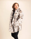 Man wearing a animal print faux fur coat against a plain background. SpiritHoods Animal Print Coats and Jackets, Custom Made Fall Winter Styles.