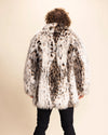 A Man facing away from the camera wearing a cheetah pattern fake fur coat against a beige background. SpiritHoods Custom Made Fall Winter Fake Fur Jackets for Men.