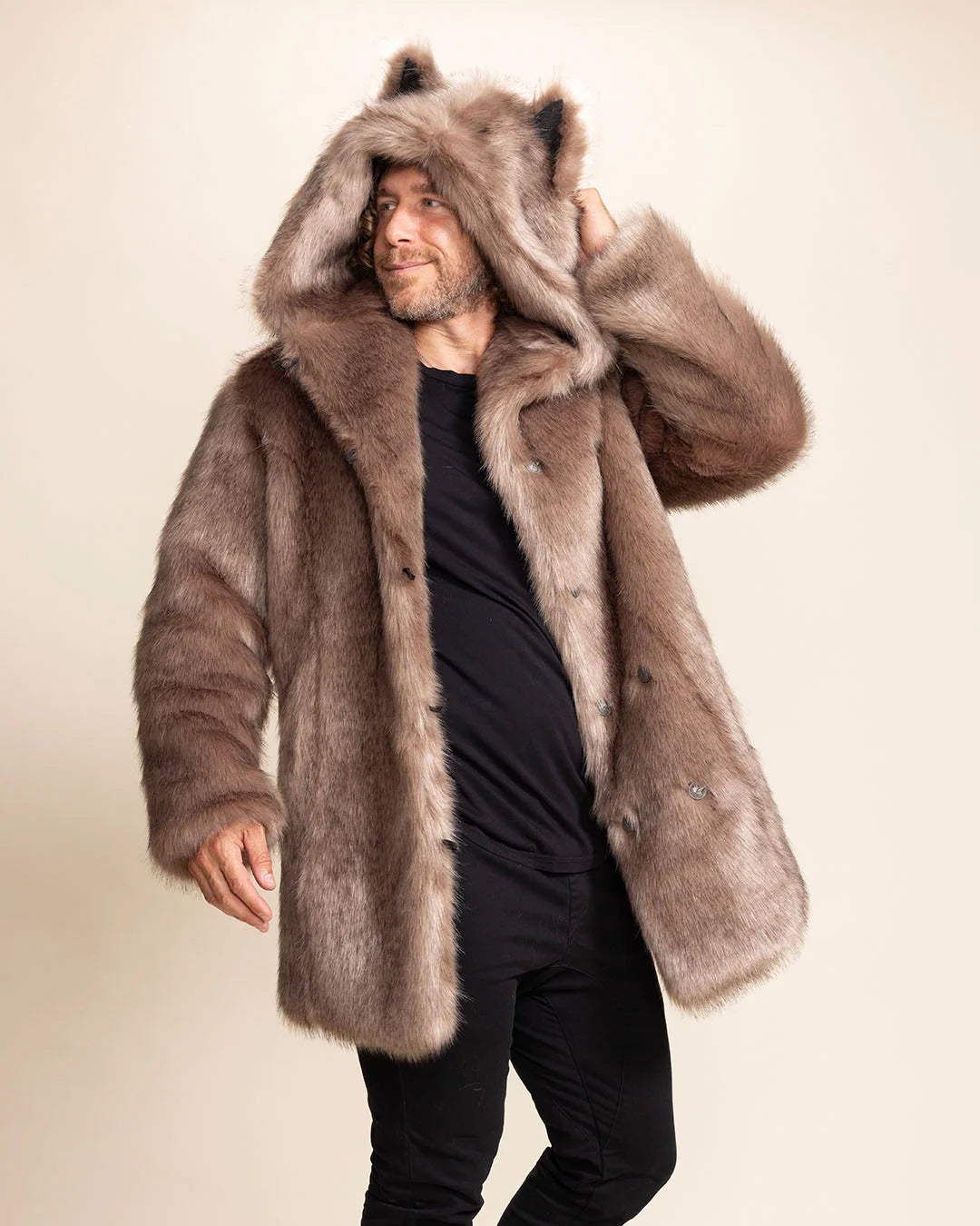A Man wearing a brown faux fur coat with a hood and wolf ears, on a plain background. SpiritHoods Fall Winter Collection of 100% Fake Fur Coats and Faux Fur Jackets
