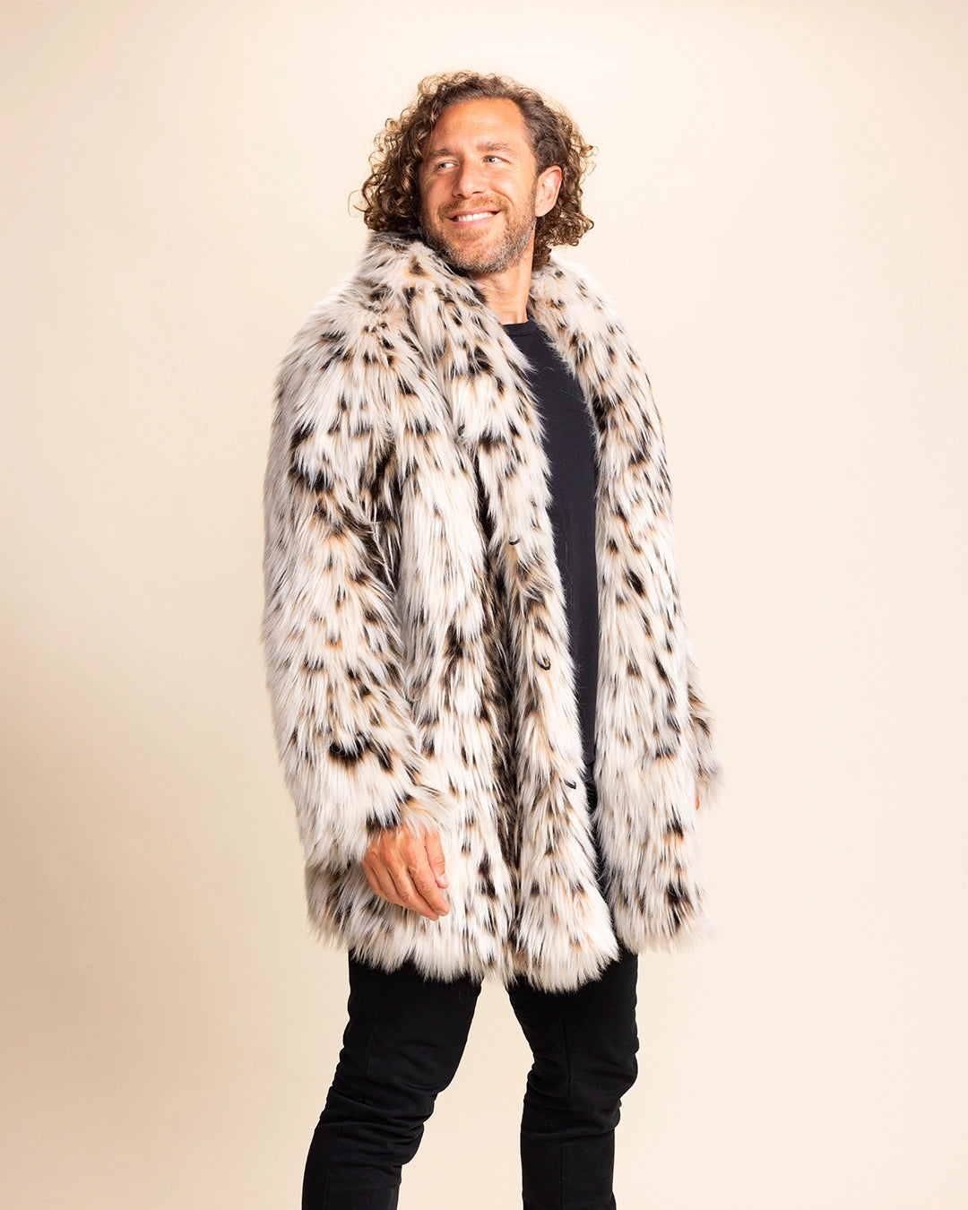 Man wearing a cheetah patterned fur free fur coat against a plain background. SpiritHoods Made to Order Animal Print Fake Fur Jackets for Men