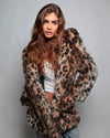 Woman wearing a leopard print fur free fake fur jacket against a gray background. SpiritHoods Made to Order Fall Coat Collection of Faux Fur Coats and Animal Print Jackets