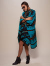 Woman wearing Grey Wolf Fabric Poncho, side view 2