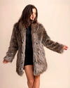 Woman wearing a SpiritHoods Dire Wolf Faux Fur coat against a plain background