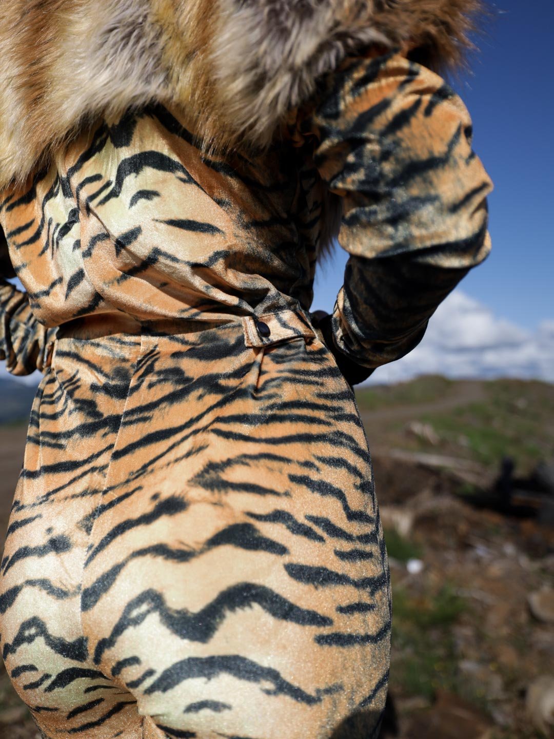 Woman wearing Liger Velvet Classic Faux Fur Animal Onesie, back view 3
