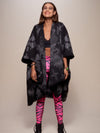 Woman wearing Night Fox Fabric Poncho, front view 1