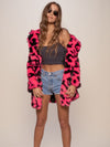 Woman wearing Neon Pink Leopard Classic Faux Fur Coat, front view 2
