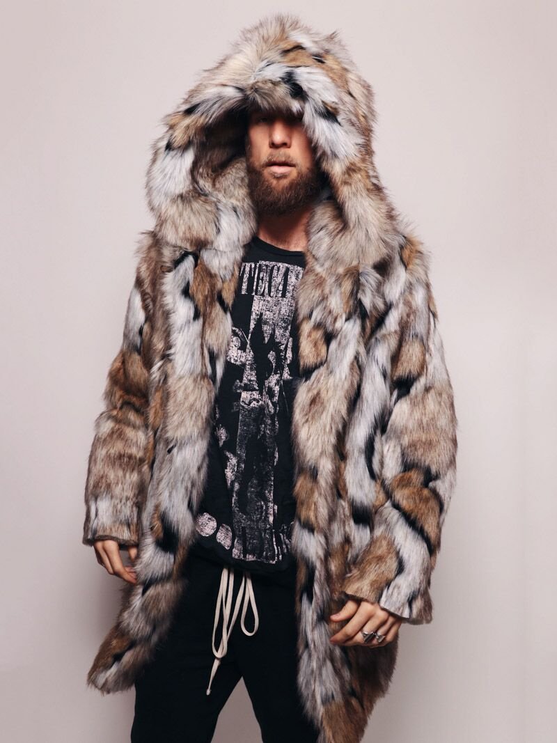 A man in the shadows, leaning against a pillar with one hand in his pocket, wearing a realistic fur Hooded Wolverine Coat.