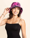 Woman wearing a pink and black tiger print bucket hat on a beige background