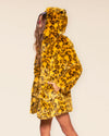 Woman wearing a Yellow Cheetah Classic faux fur coat with an oversized hood and animal ears.