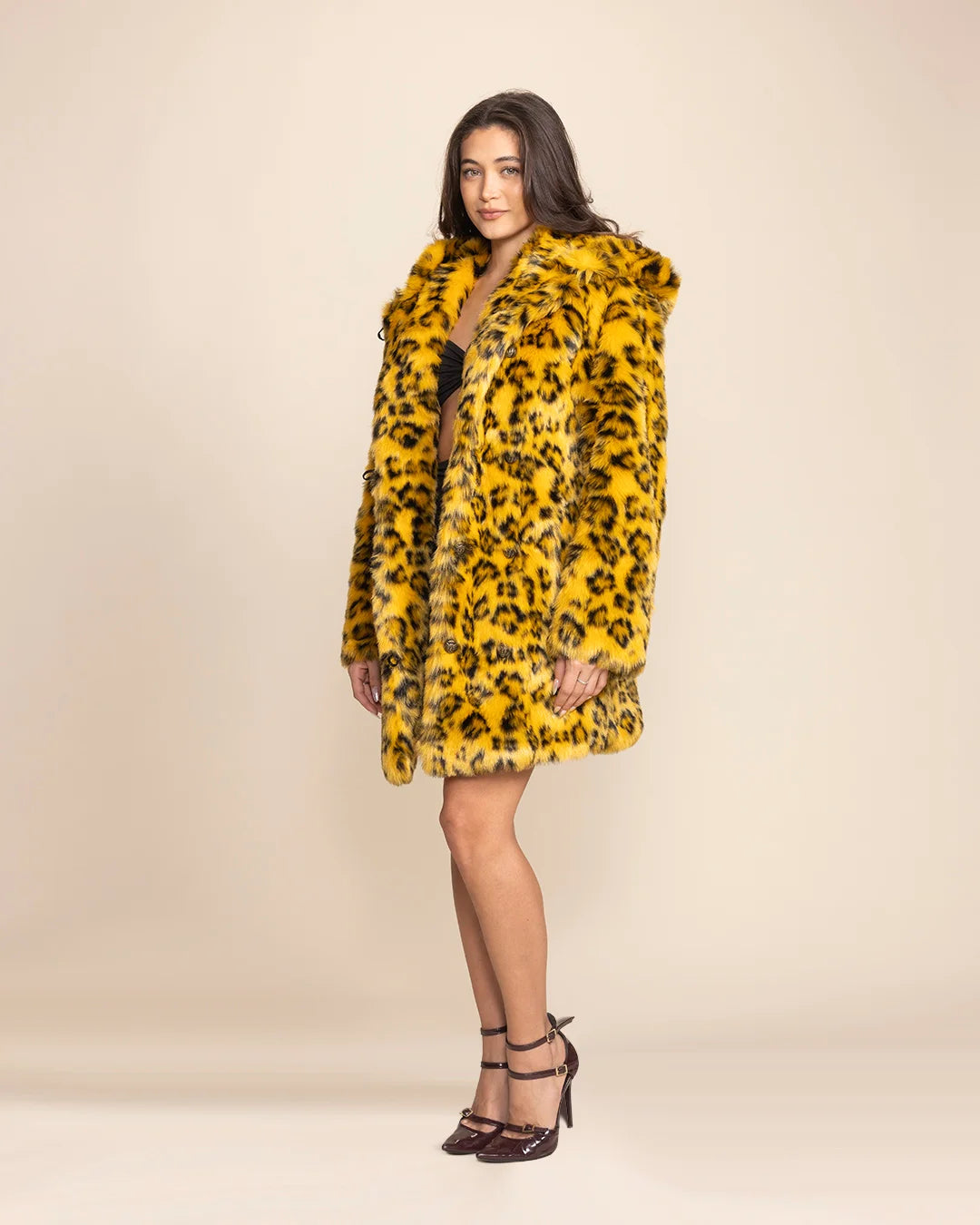 Top-rated festival fashion: a vibrant yellow cheetah print fake fur jacket featuring ultra-soft vegan materials