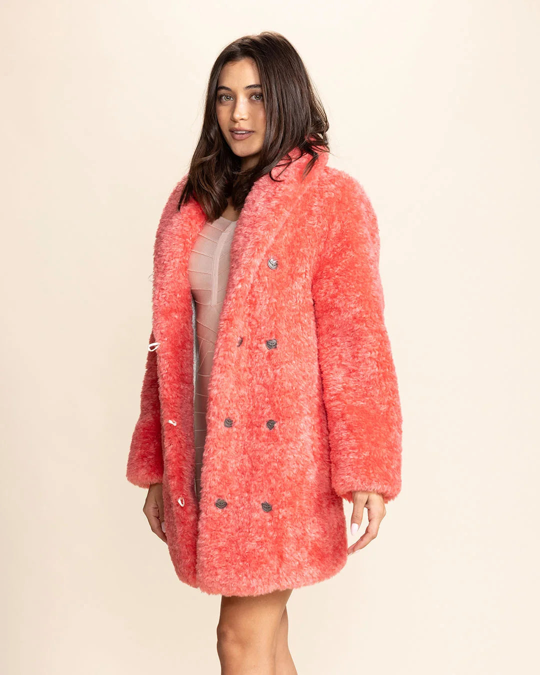 Modern women's streetwear featuring a vibrant pink panther collared faux fur jacket with a relaxed silhouette