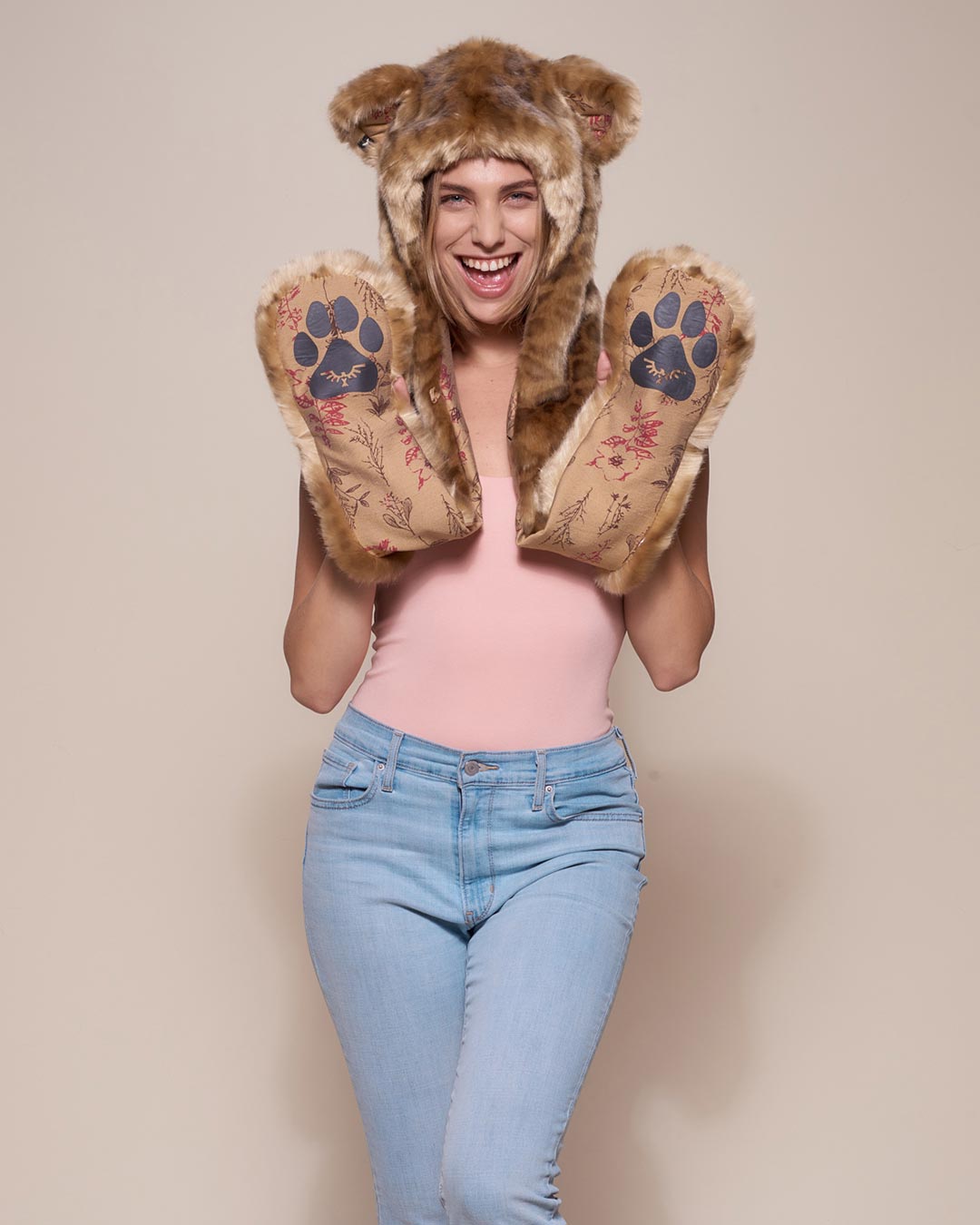 Woman wearing African Golden Cat Luxe Faux Fur Collector Edition Hood, front view