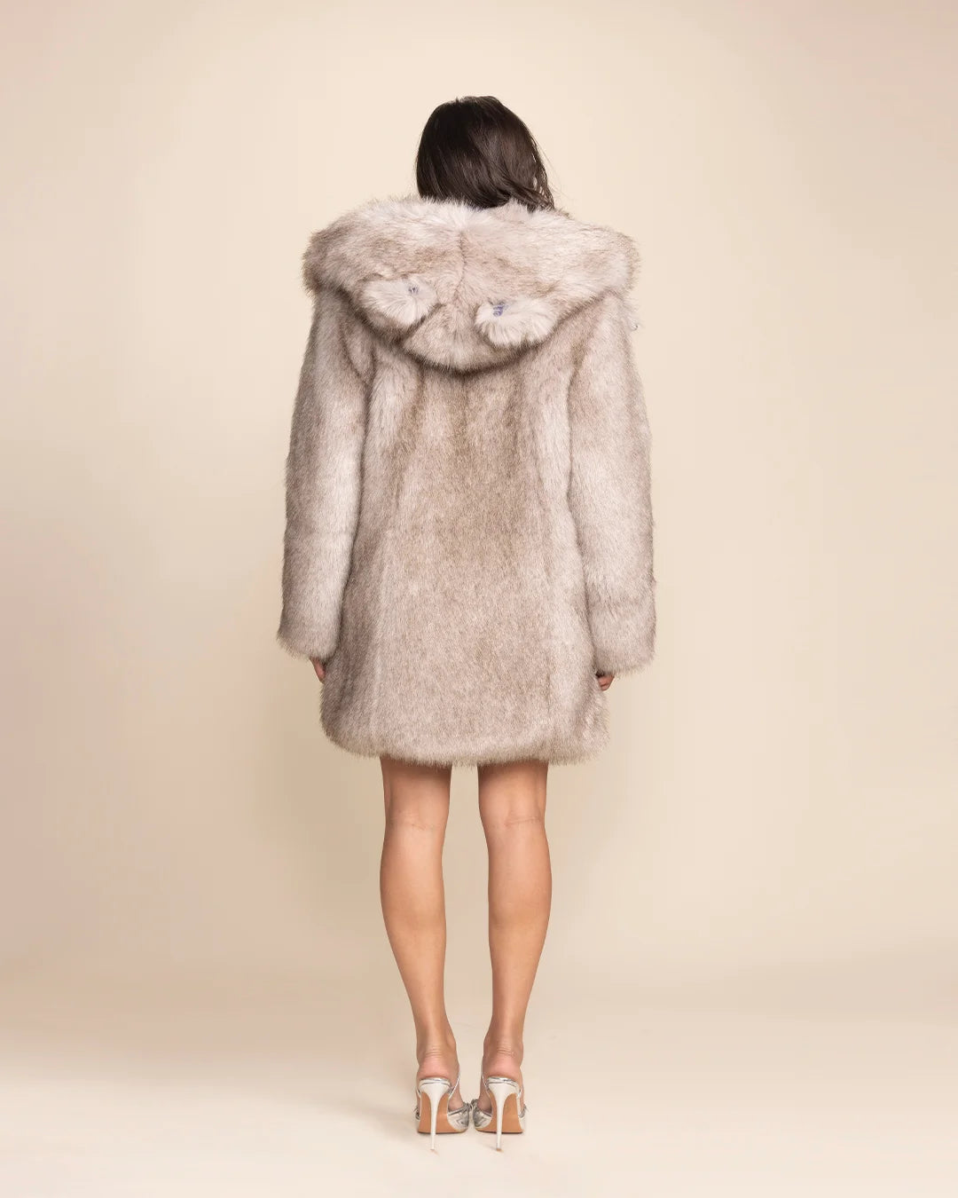 Oversized Hooded fake fur jacket for women, perfect for winter, festivals and cold-weather events.