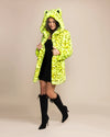Bold streetwear style for women: a neon yellow leopard faux fur jacket with a large hood and premium vegan fake fur.