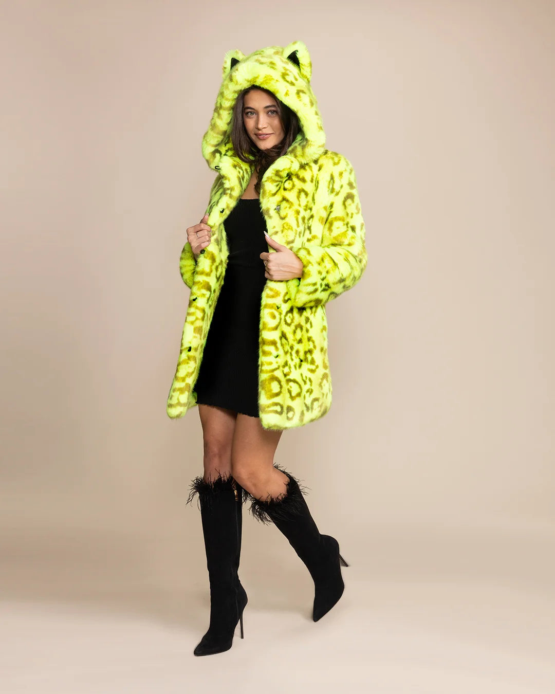 Bold streetwear style for women: a neon yellow leopard faux fur jacket with a large hood and premium vegan fake fur.