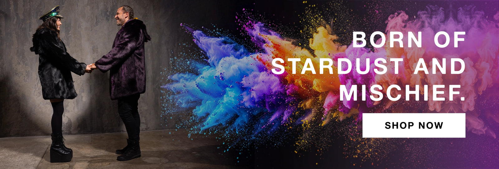 Two people holding hands with a colorful explosion and promotional text 'Born of Stardust and Mischief. Shop Now'